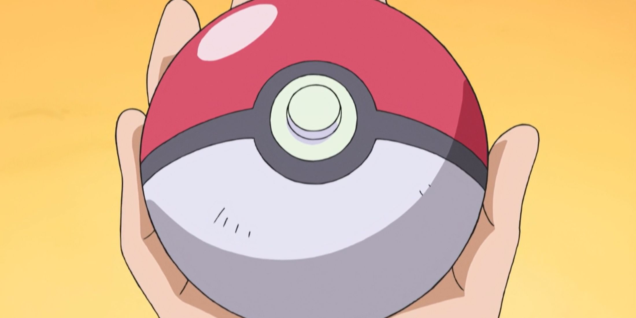 A screenshot of a hand holding a Poke Ball in the Pokemon anime.