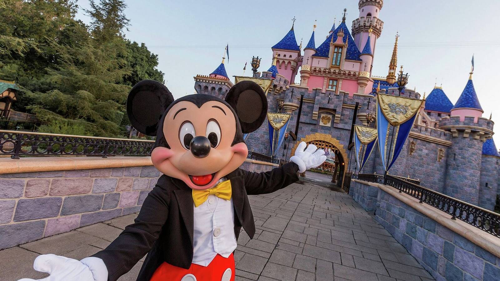 Mickey Mouse in front of Disneyland's Sleeping Beauty Castle