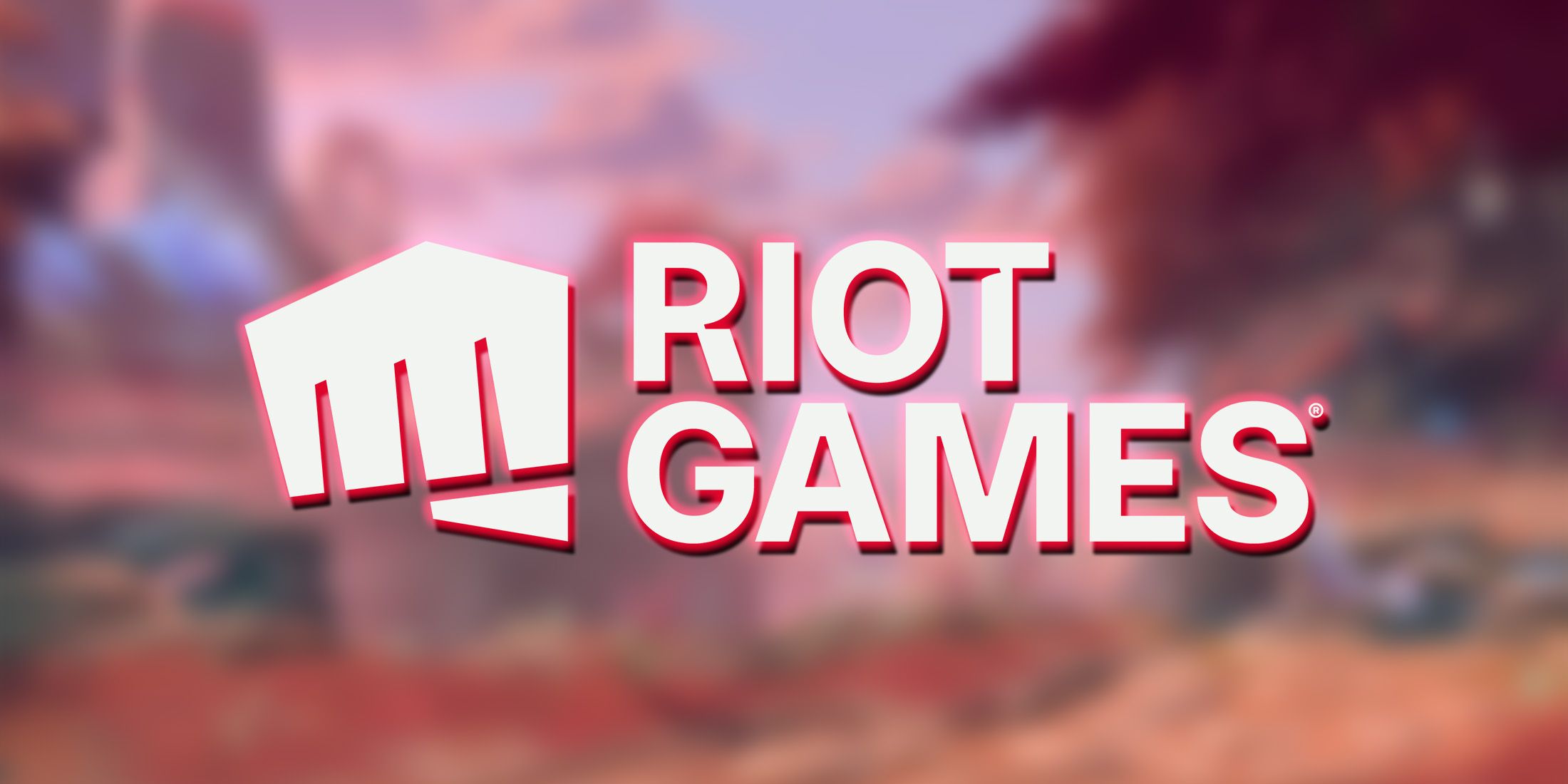 Riot Games logo on blurred 2XKO arena environment artwork