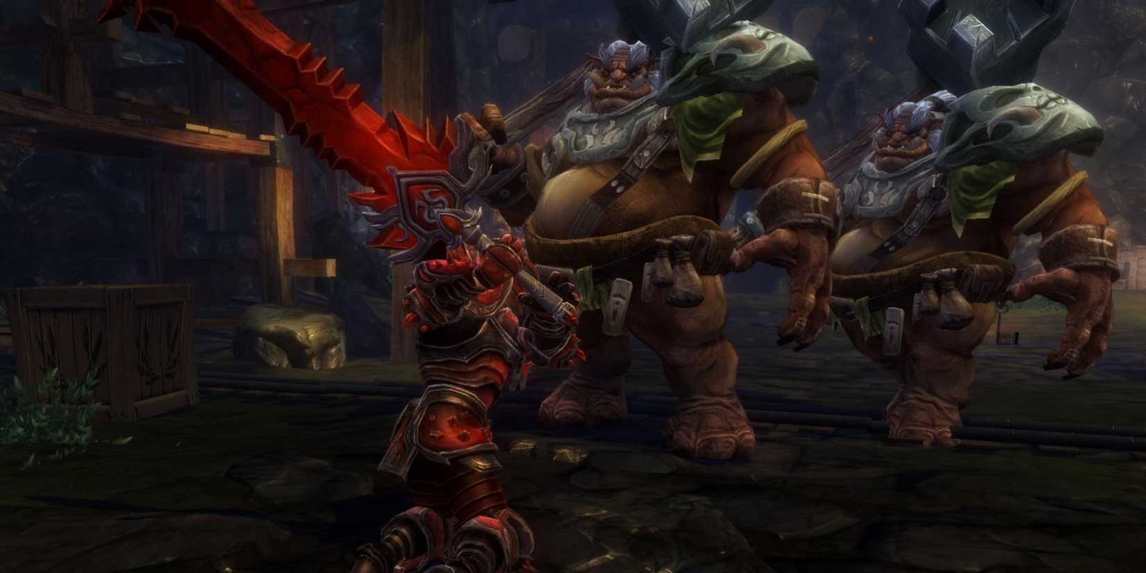A player holding a large red sword being approached by two large enemies in Kingdoms of Amalur: Reckoning 