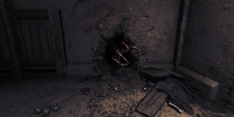 A clawed hand emerging from a large hole in a concrete wall in Amnesia: The Bunker