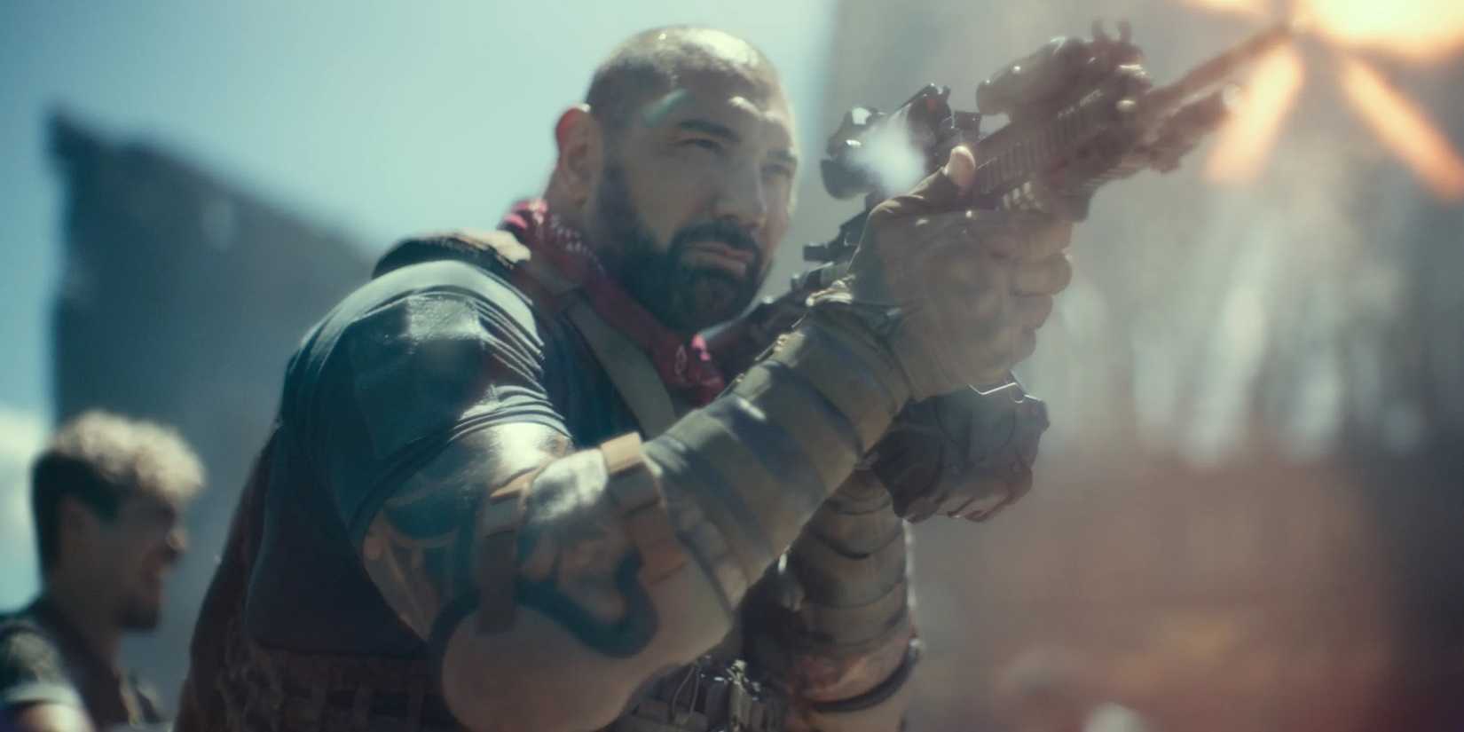 Best Bautista Roles- Dave Bautista holding a gun in Army of the Dead