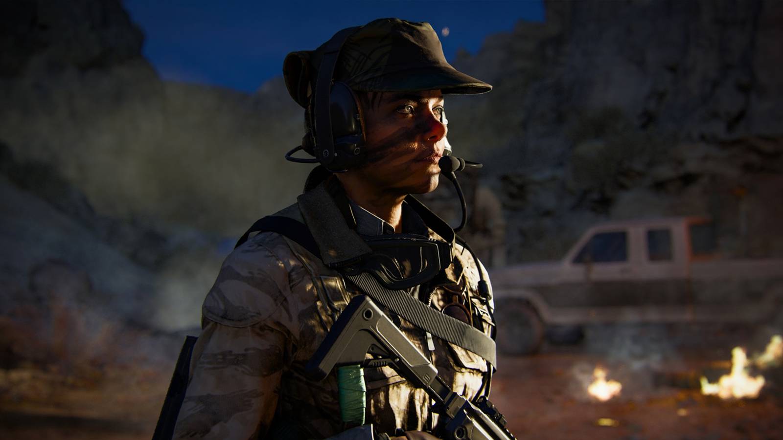 Call of Duty: Black Ops 6 operator in military gear, standing in a rugged environment during a night time mission