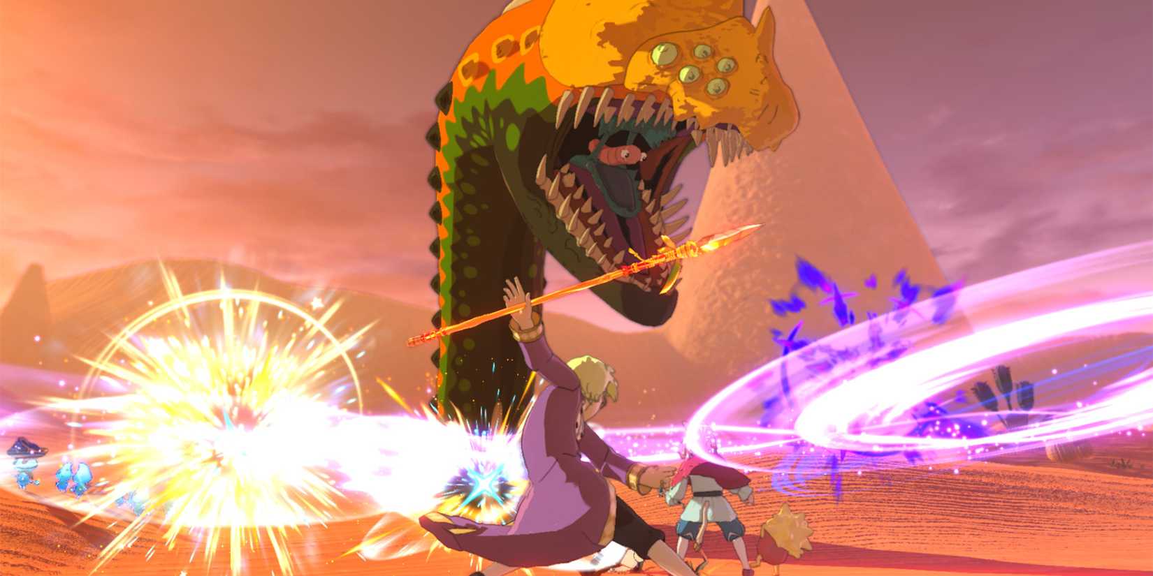 Characters battling a giant monster in a desert setting in Ni No Kuni 2 Revenant Kingdom