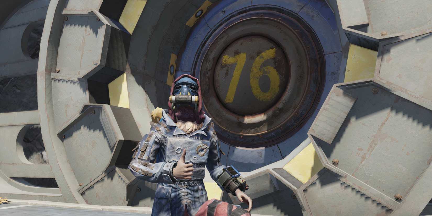 Fallout 76 Player Thumbs Up Emote in front of Vault 76 Door wearing Blue Ridge Caravan Outfit Milepost Zero Update September 3 GAMERANT custom image