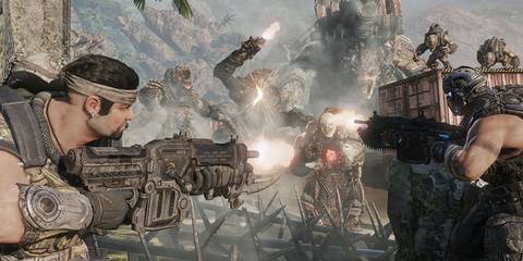 main characters shooting at a horde of enemies in gears of war 3