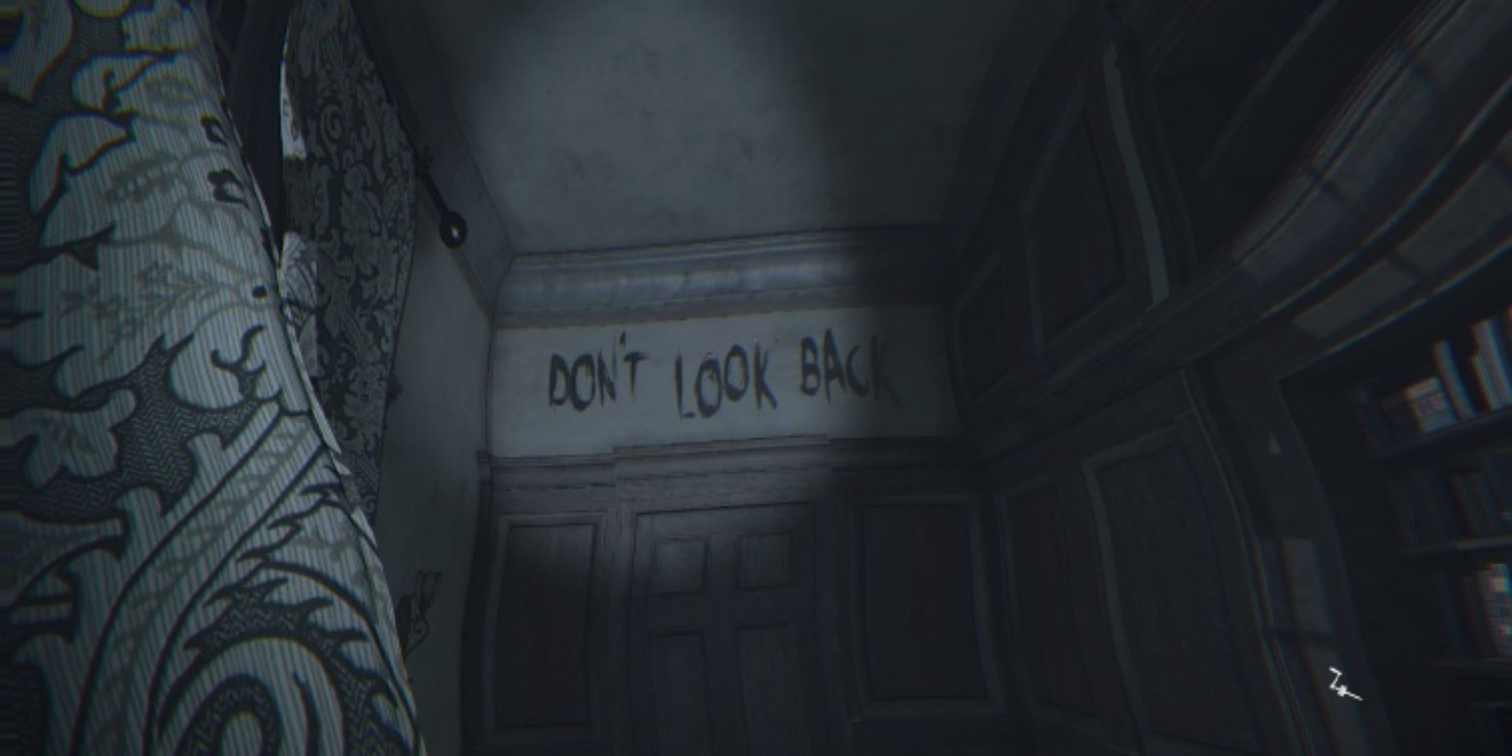 A sign above a doorway reading 'Don't look back'