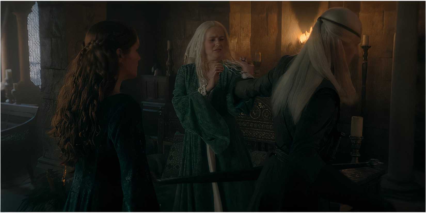 Alicent Hightower watches as Aemond drags Helaena in House of the Dragon.