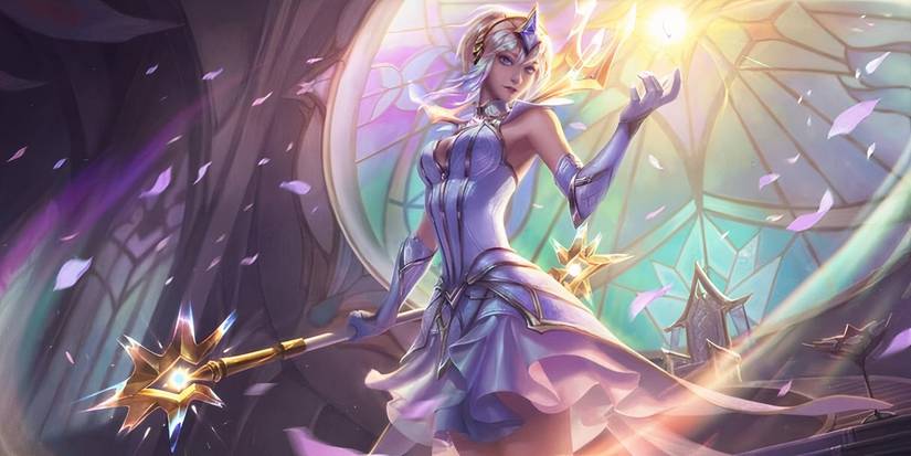 Elementalist Lux produces a beam of light in her League of Legends splash art.