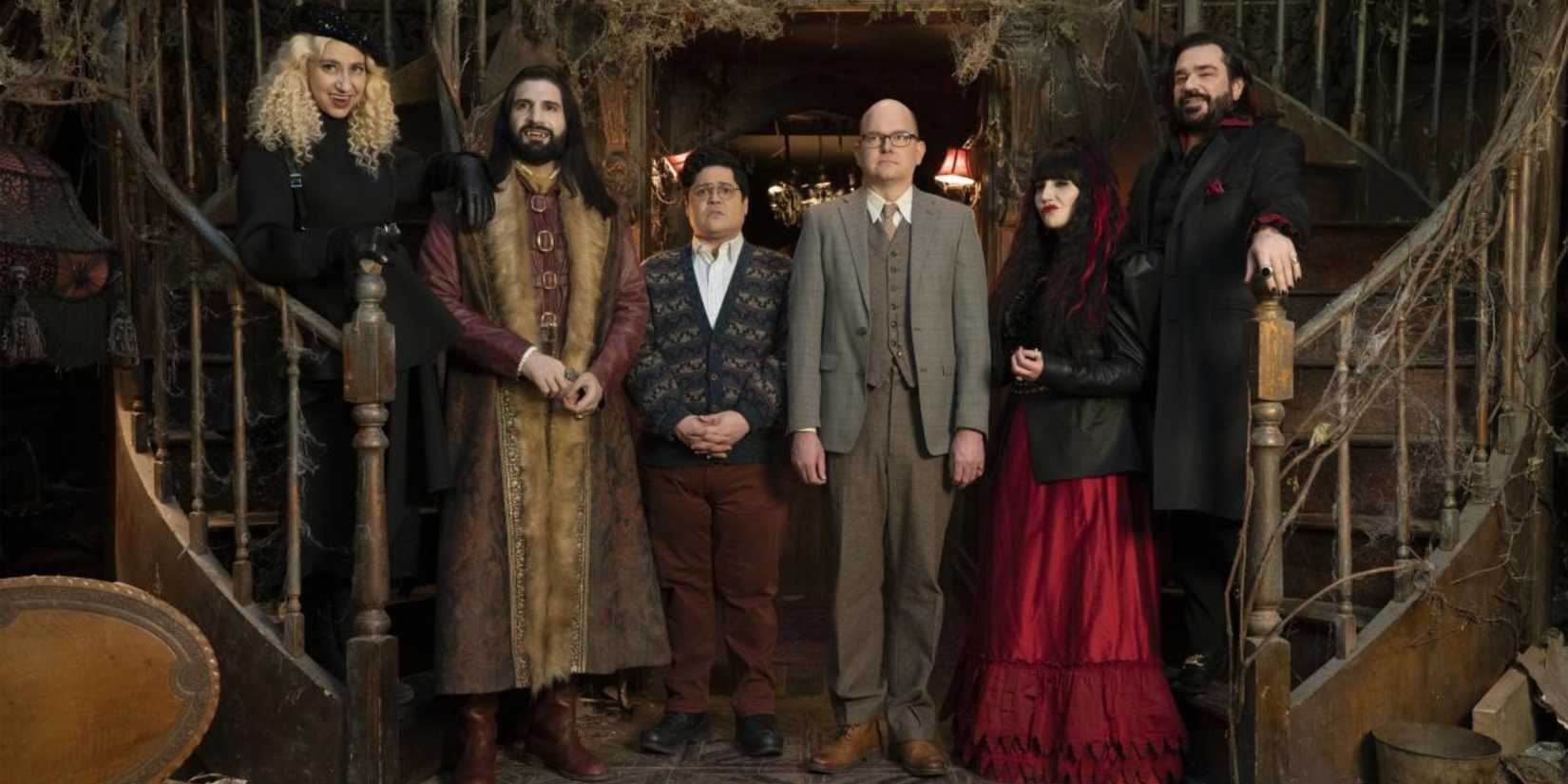 What We Do In The Shadows characters standing on a staircase