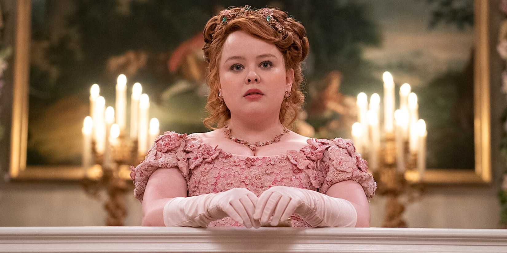 Penelope Featherington (Lady Whistledown) in a pink dress