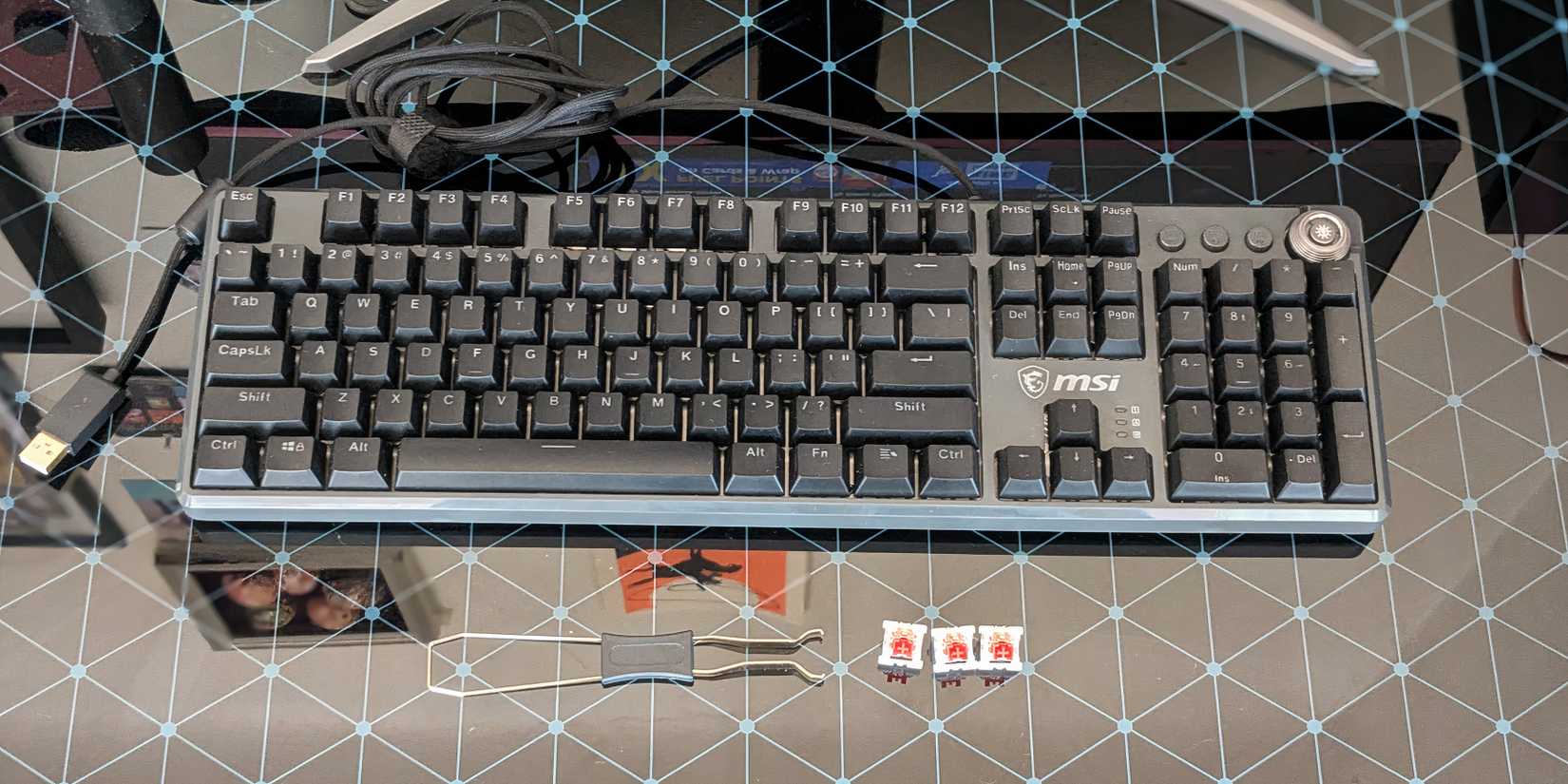 MSI Forge GK310  with keycap puller and extra switches