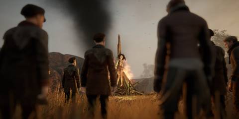 The townspeaple in the forefront while a Witch burns on the pyre in Pathologic 2