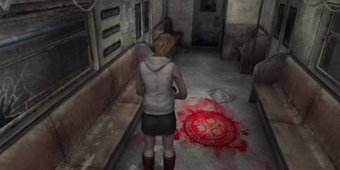 Heather Mason standing in a train carriage staring at a red symbol on the ground