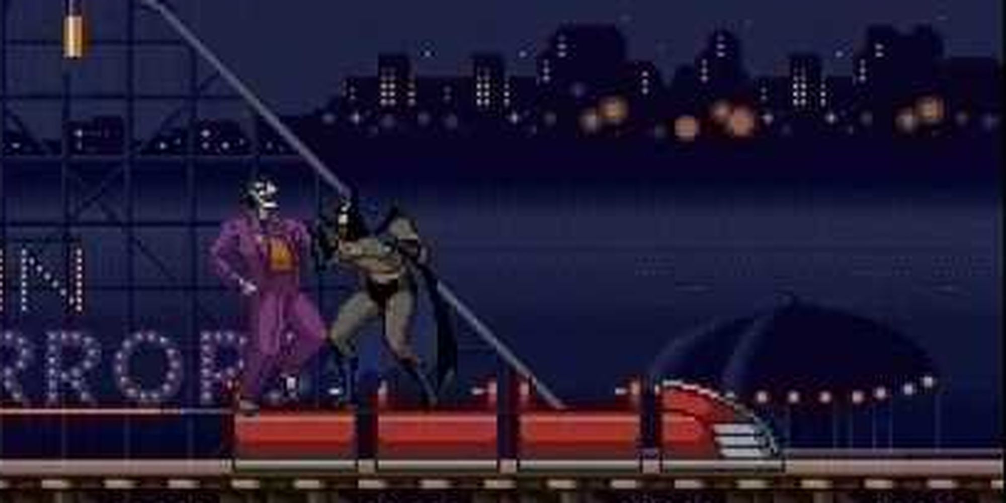 Batman fighting the joker on a roller coaster