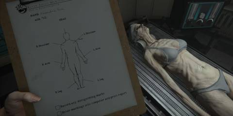 A dead body lying on a gurney with an anatomy clipboard in the player's hand in The Mortuary Assistant