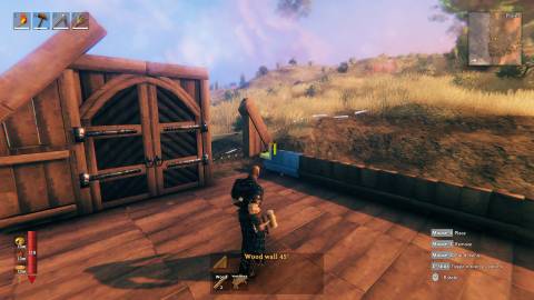 Valheim players building a wooden structure