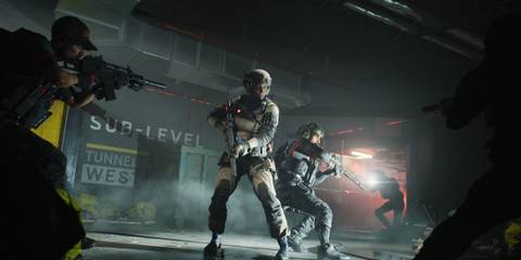 Soldiers in tactical gear clearing an underground tunnel area in an intense combat scene from Battlefield 2042