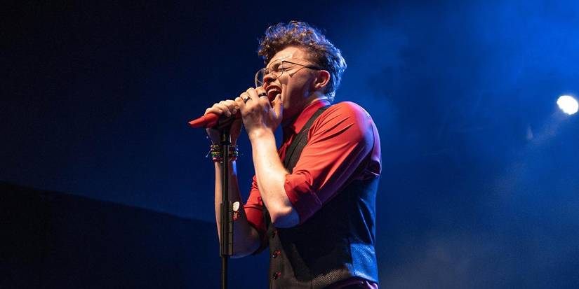 CG5 singing into mic during international tour