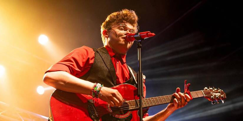 CG5 live onstage with guitar