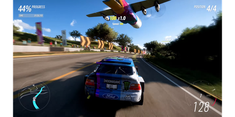 Driving on a road while a plane flies overhead