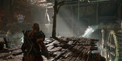 Kratos standing in front of a shoddily built wooden plank