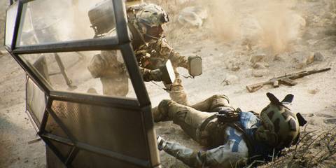 A soldier reviving a teammate with shock paddles in BF 2042