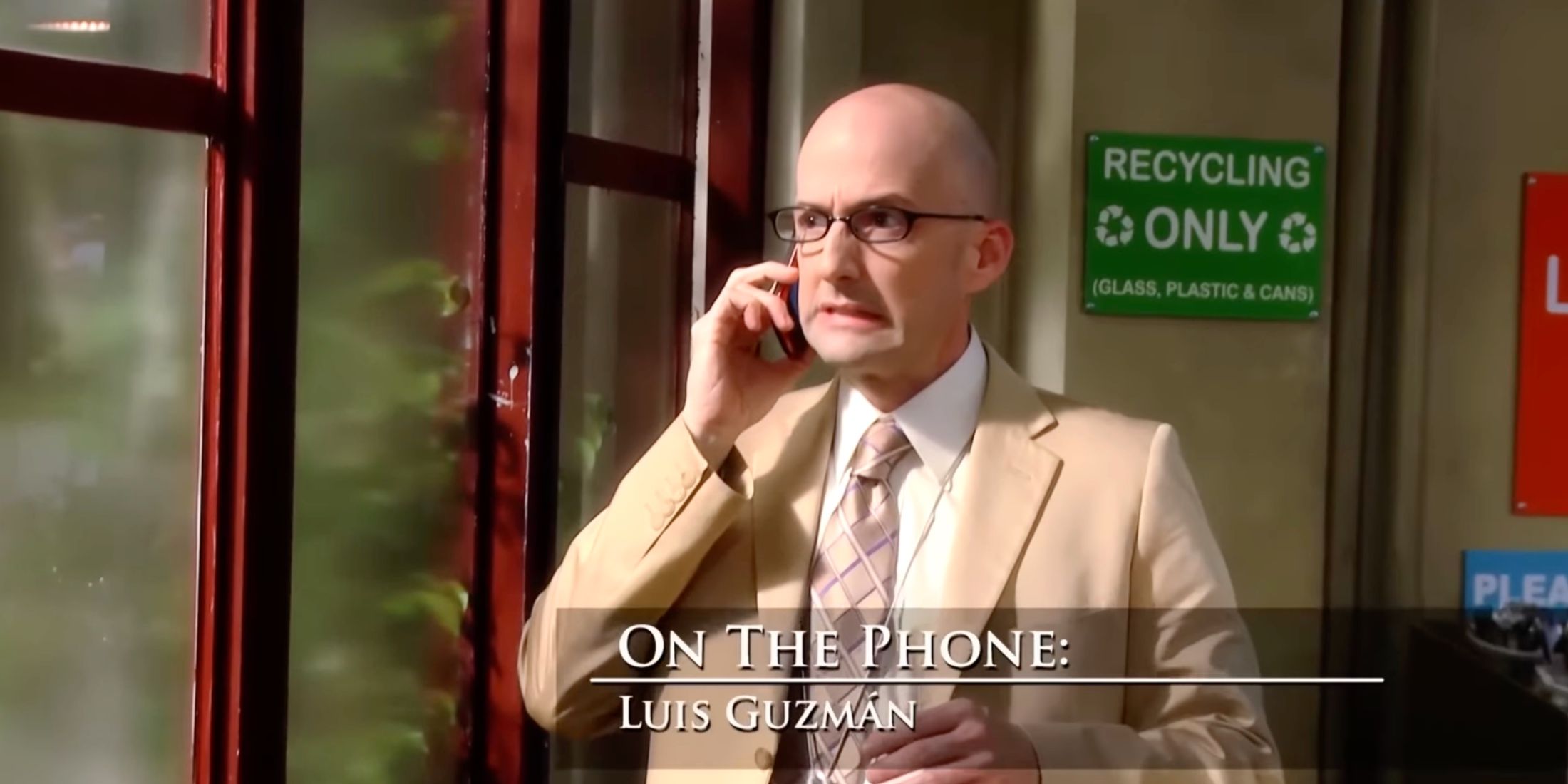 dean pelton on the phone with Luis Guzman, grimacing