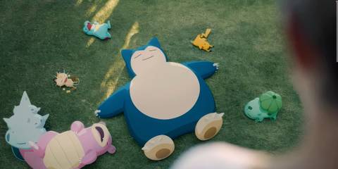 pokemon sleeping in a field