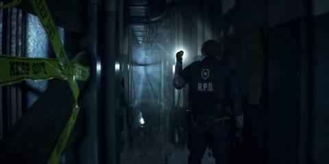 Leon Kennedy shining flashlight down a hall in Resident Evil 2