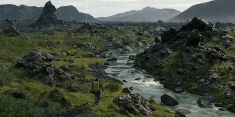 Sam Porter Bridges walks towards a river filled with rocks in Death Stranding