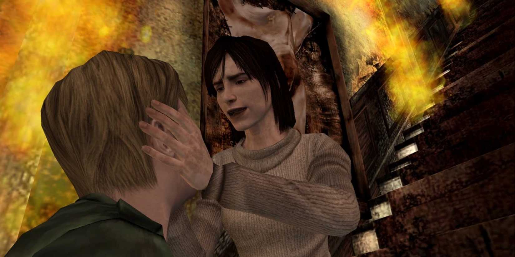 Maria holding James' face on a burning stairwell