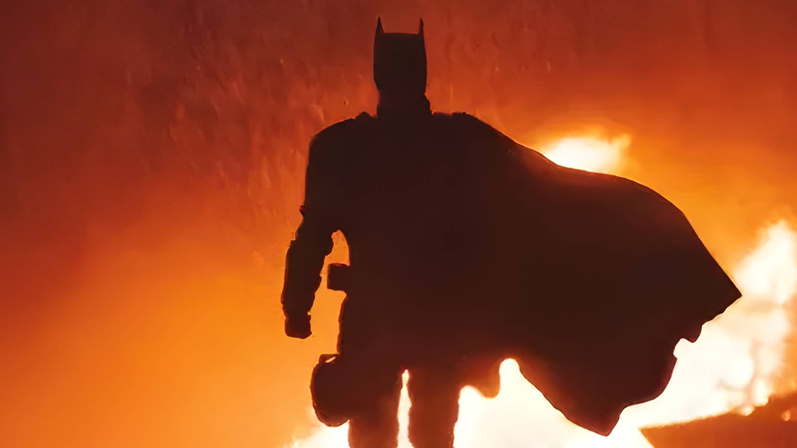 The Batman Walking Away from fire with silhouette