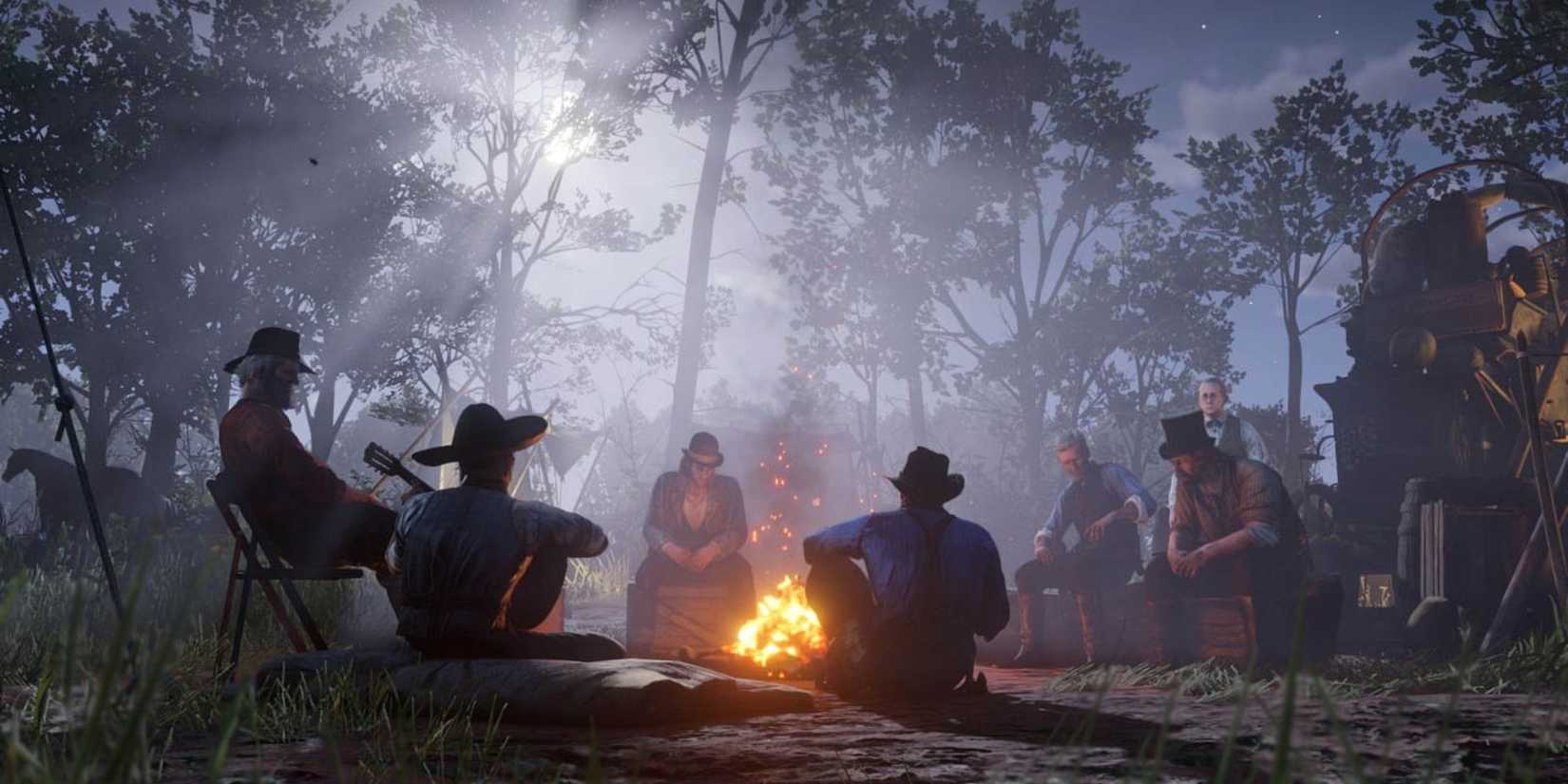 camp members sitting around a fire at night in red dead redemption 2