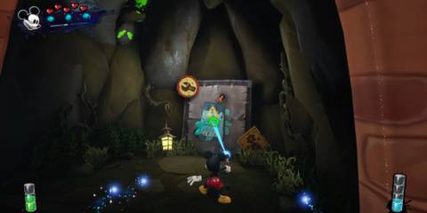 Mickey painting a power box in Epic Mickey: Rebrushed