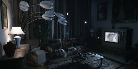 A modern looking living room showing an old black and white show on TV