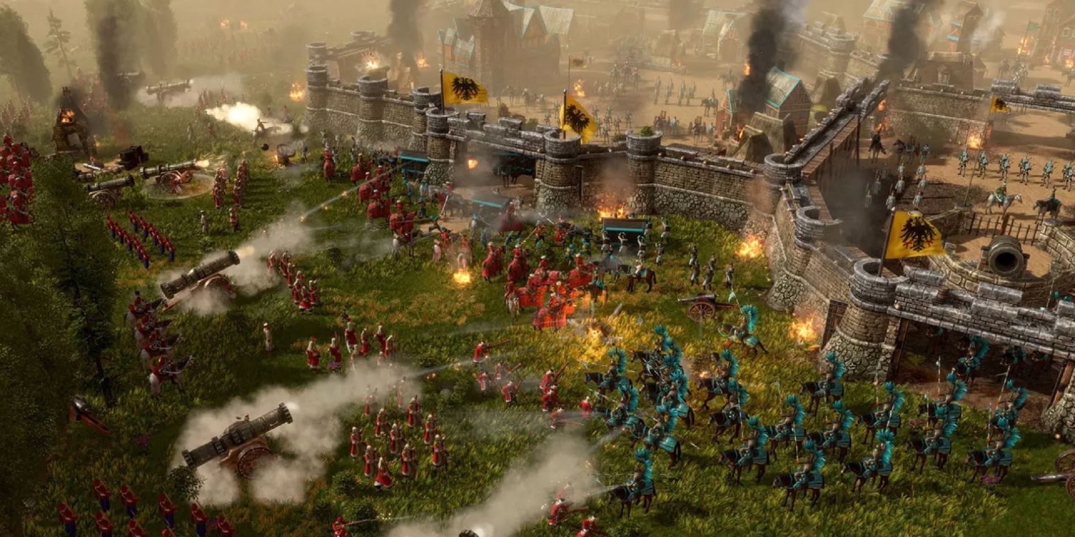 Large-scale medieval battle scene with cannons and infantry storming a fortified castle in Age of Empires 3