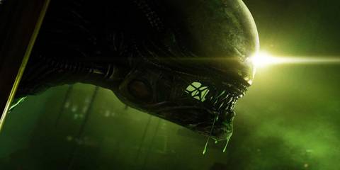A promotional image of a Xenomorph awash in green light in Alien: Isolation.