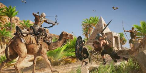 Bayek fighting enemies in Assassin's Creed: Origins