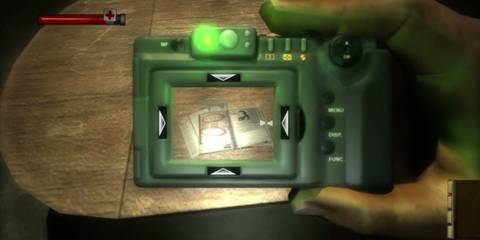 The player holding a camera up to photograph some documents