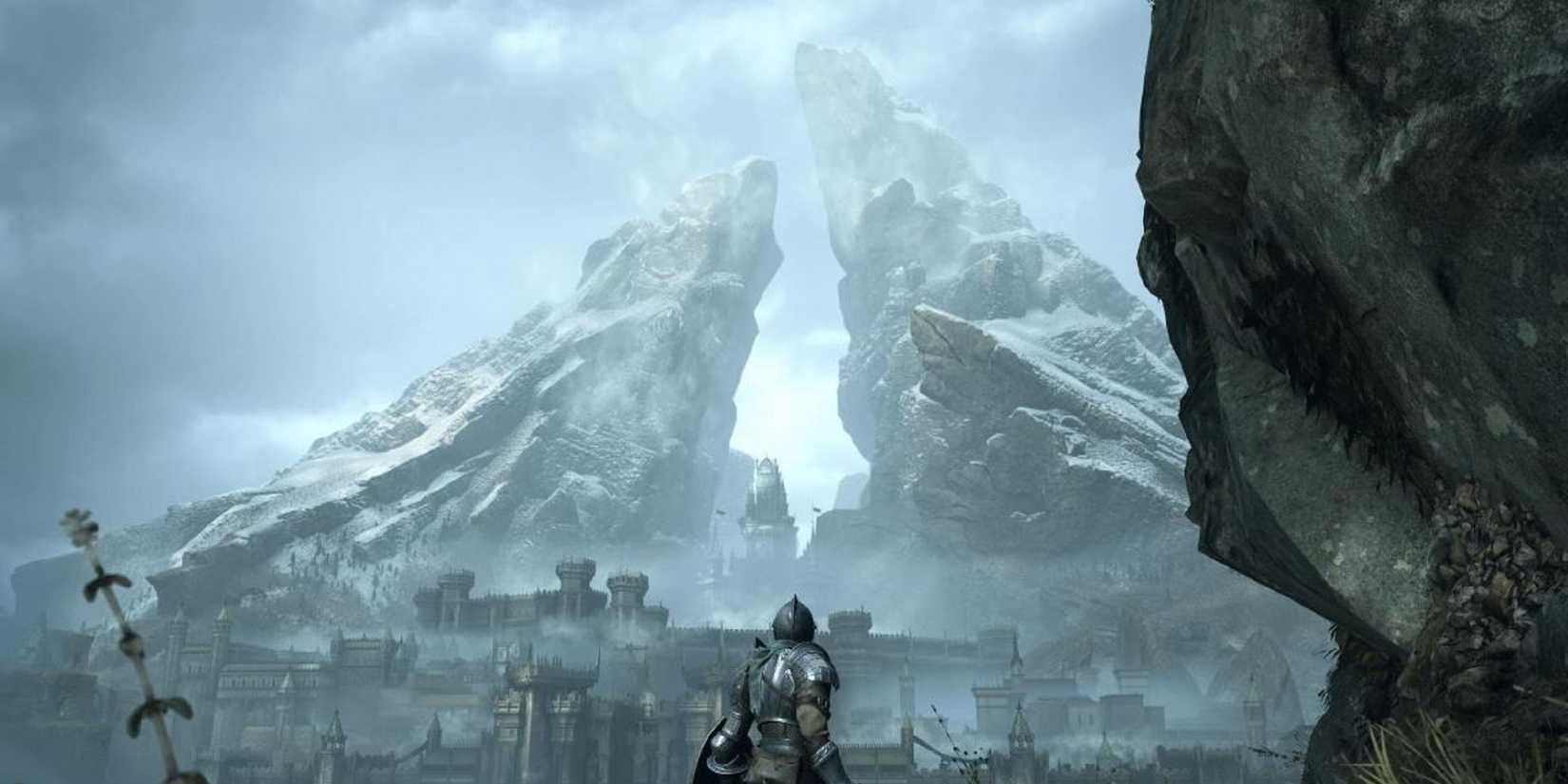 A knight in armor in front of a towering fortress made of large stones in a demon's soul
