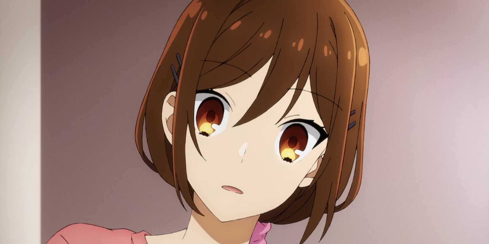 the female lead on the series Horimiya: The Missing Pieces is looking forward with a curious look on her face. 