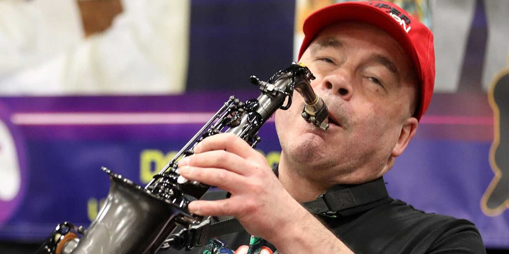 Legendary video game composer and musician David Wise playing a saxophone