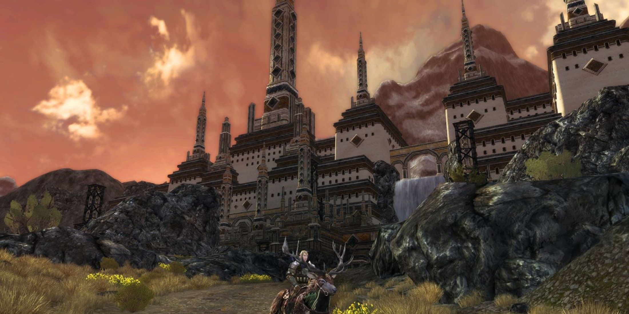 A rider on a stag approaches a grand fortress under a dramatic sky in a scene from a Lord of the Rings game