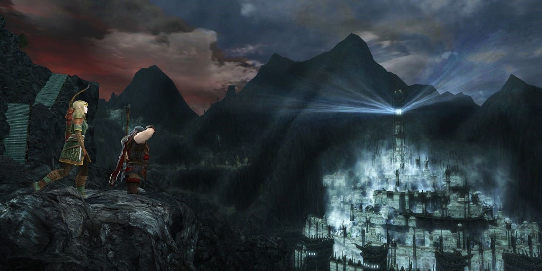 Two characters overlook a misty, illuminated fortress from a rocky ledge in a Lord of the Rings game