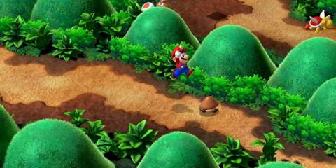 Mario jumps through a lush landscape in Super Mario RPG