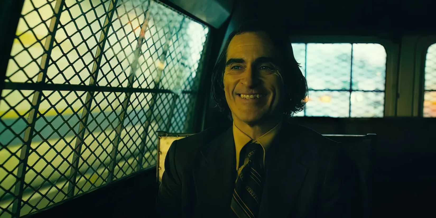 arthur in the back of a police car