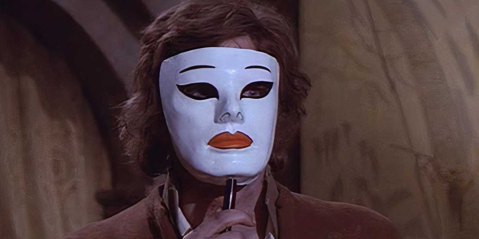 a man in a white mask with red lips
