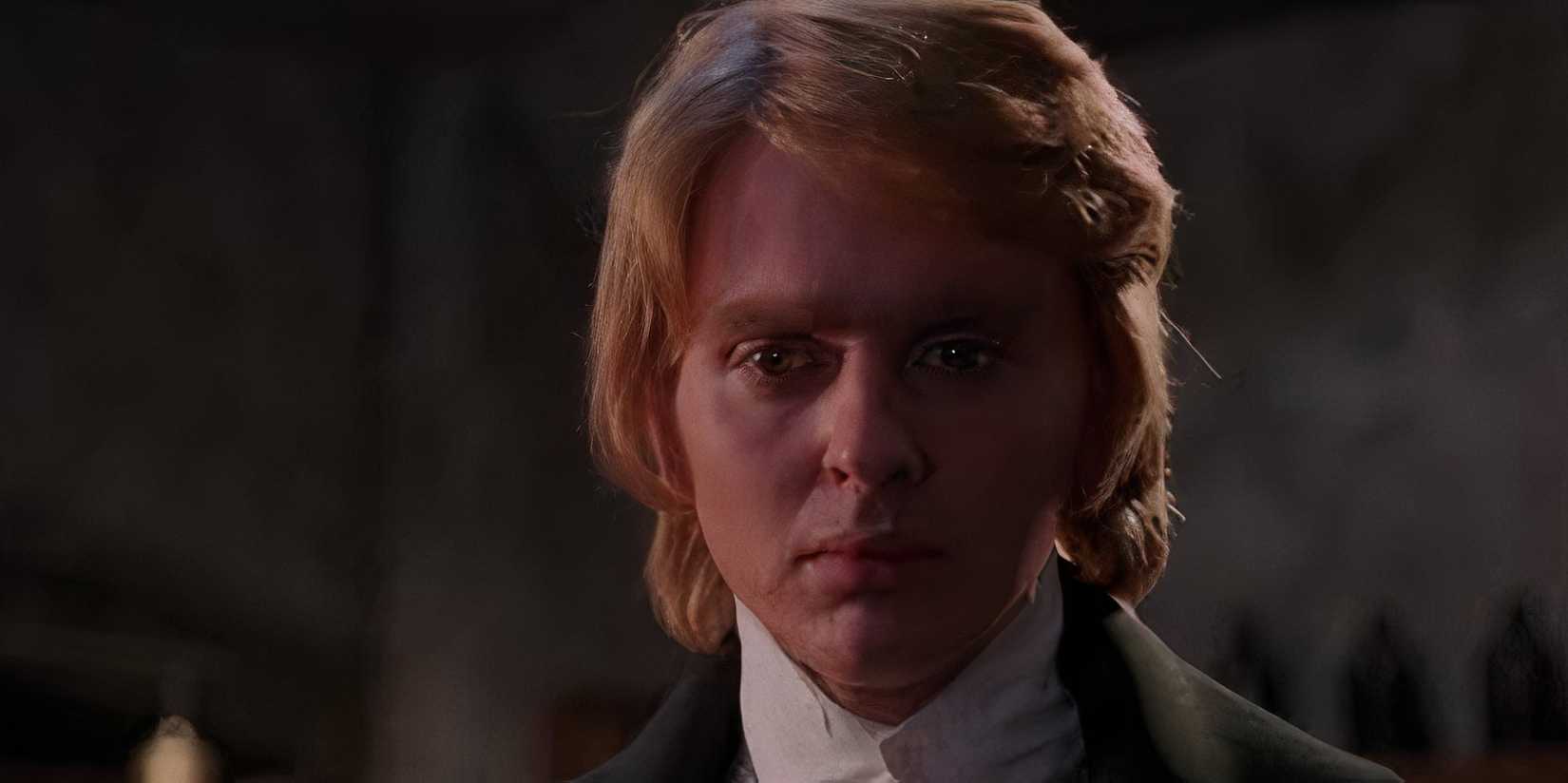 a blonde man looks sad