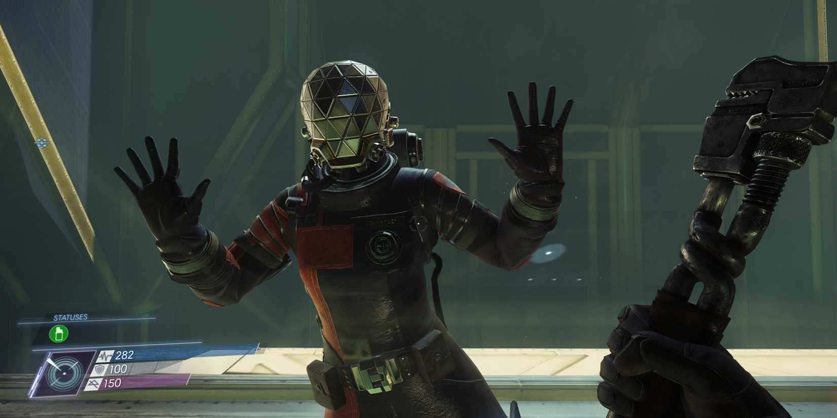 A person in a spacesuit lying flat against a window